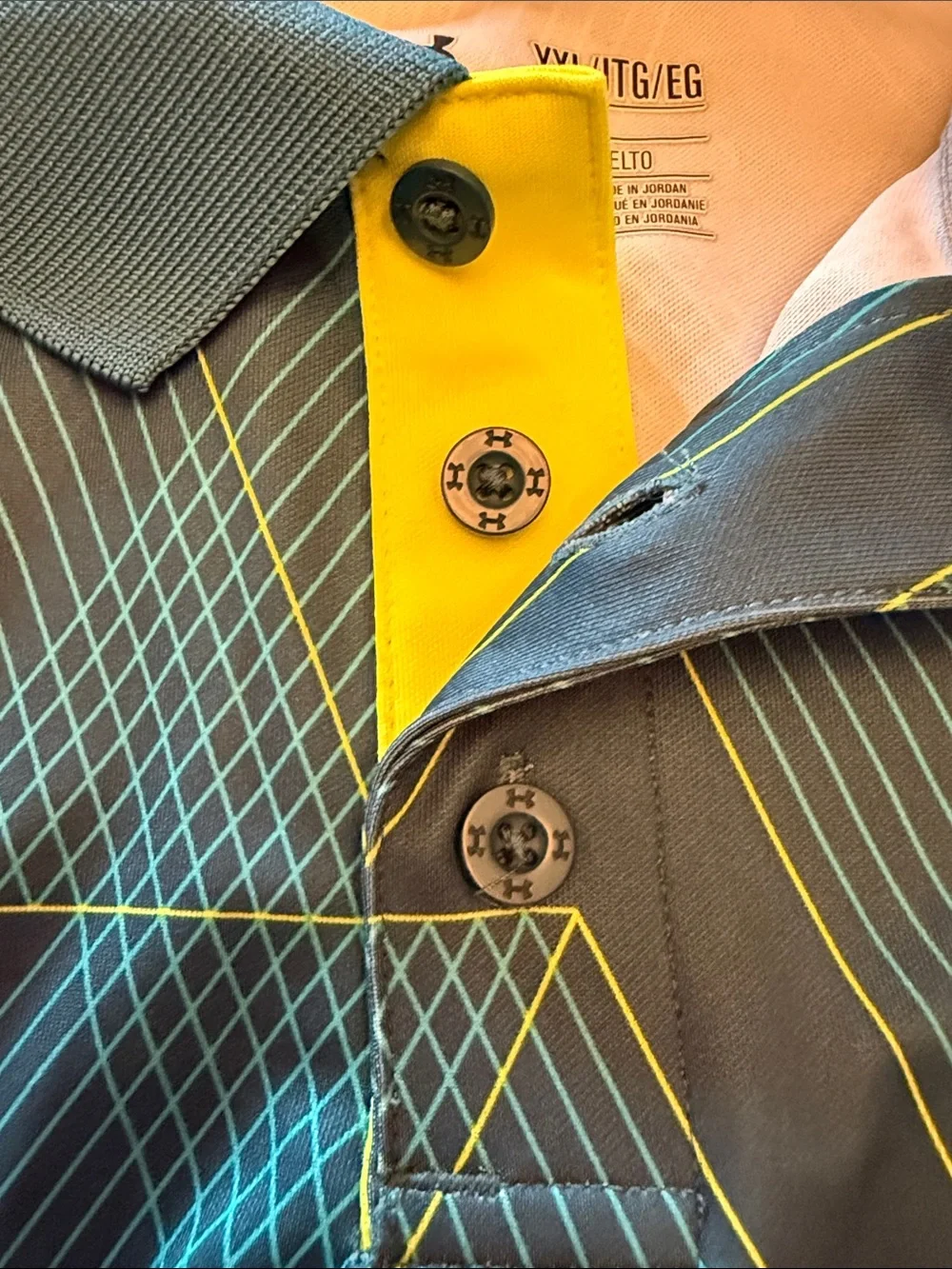 Under Armour Boys Black Polo with Yellow Logo and Teal Geometric Lines